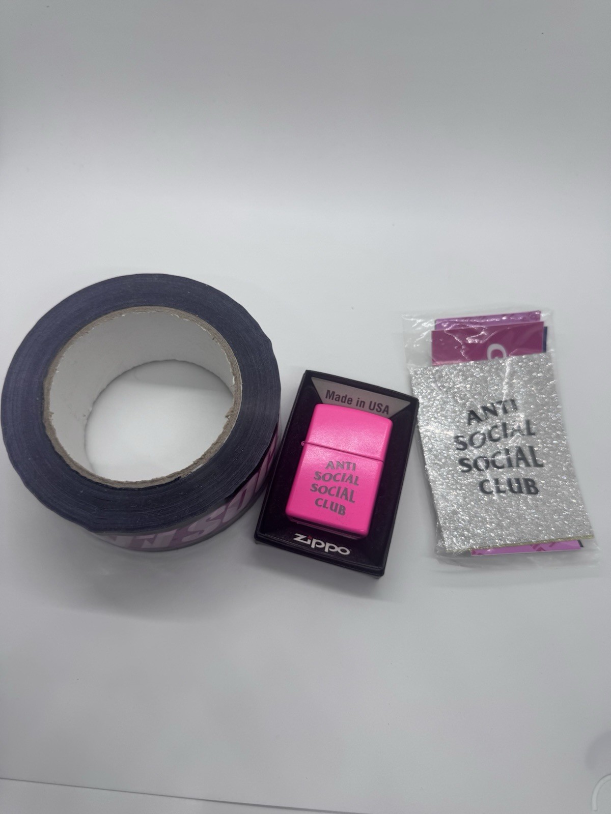 Lot Of Anti Social Social Club Items Towel, Tape, Stickers And No Regrets Zippo
