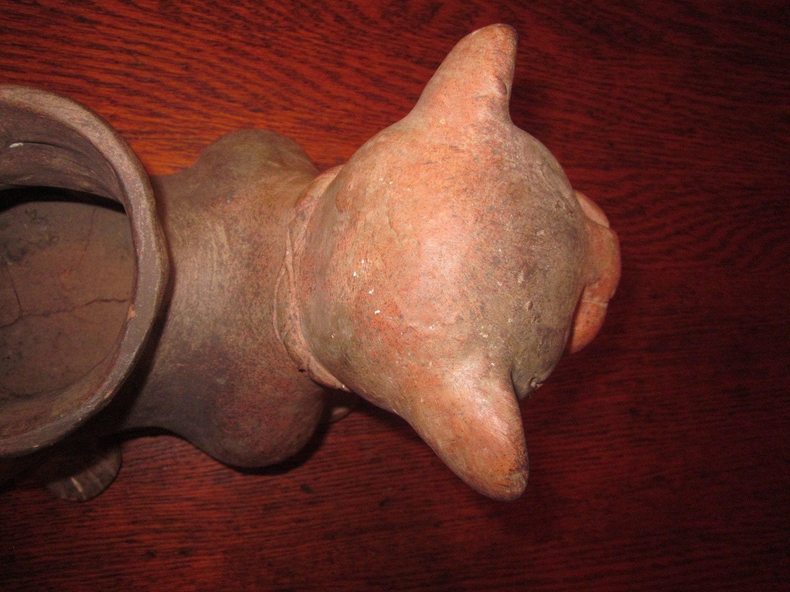It looks like a Pre-Columbian Colima Dog Lamp/Vessel, un-glazed