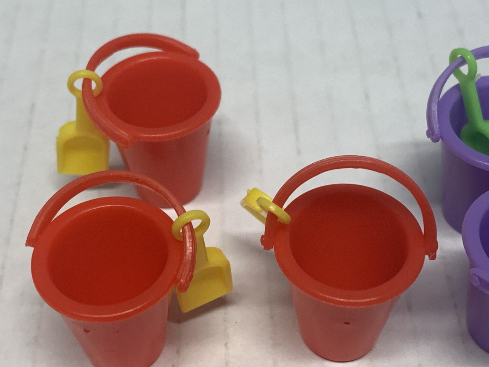 WORLDS SMALLEST MICRO TOY BOX SERIES 1,BUCKET W/SHOVEL X7. 4 RED & 3 PURPLE NICE