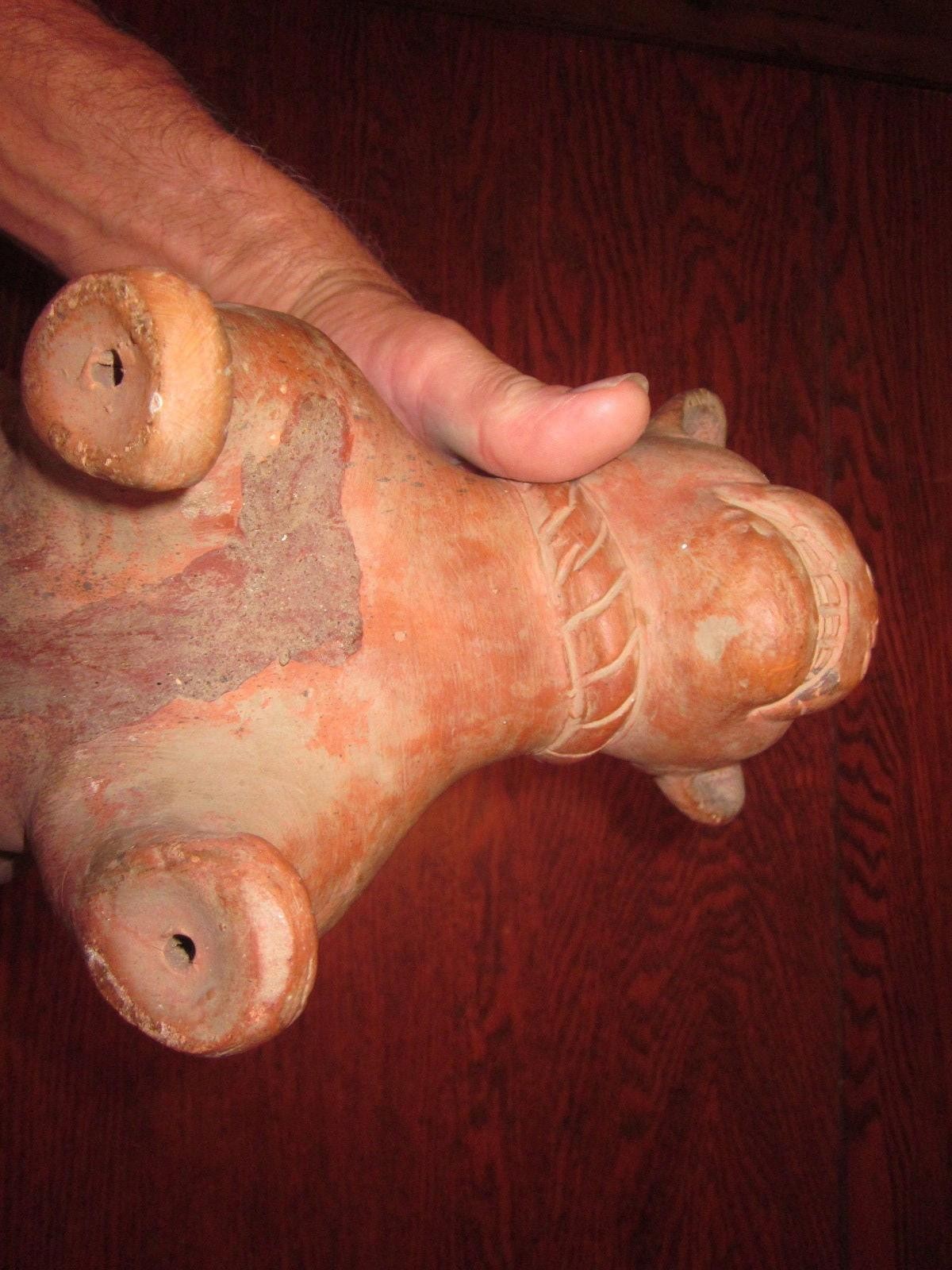 It looks like a Pre-Columbian Colima Dog Lamp/Vessel, un-glazed