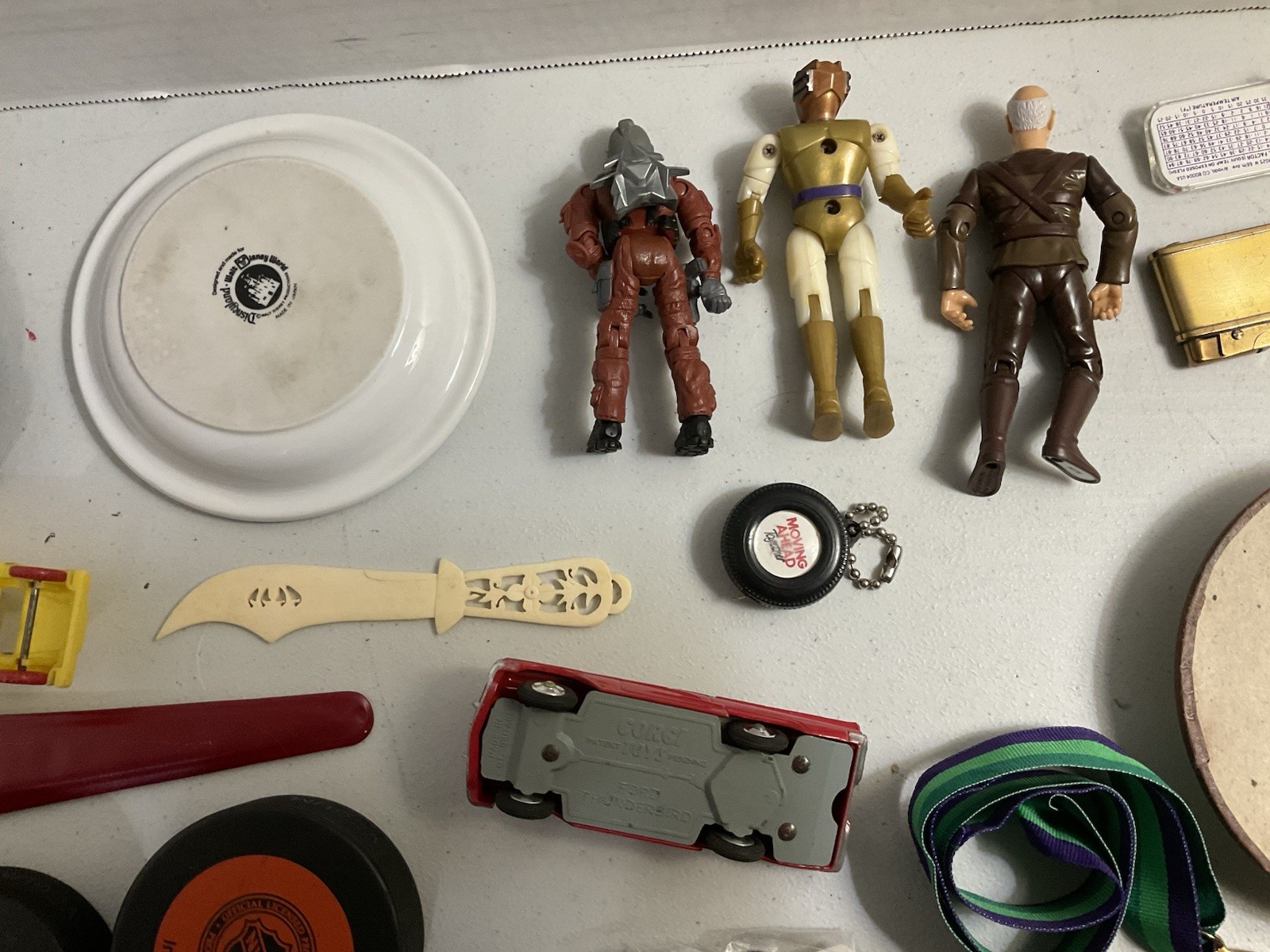 Vintage large junk drawer Lot NHL hockey pucks action figures Corgi Car Misc.