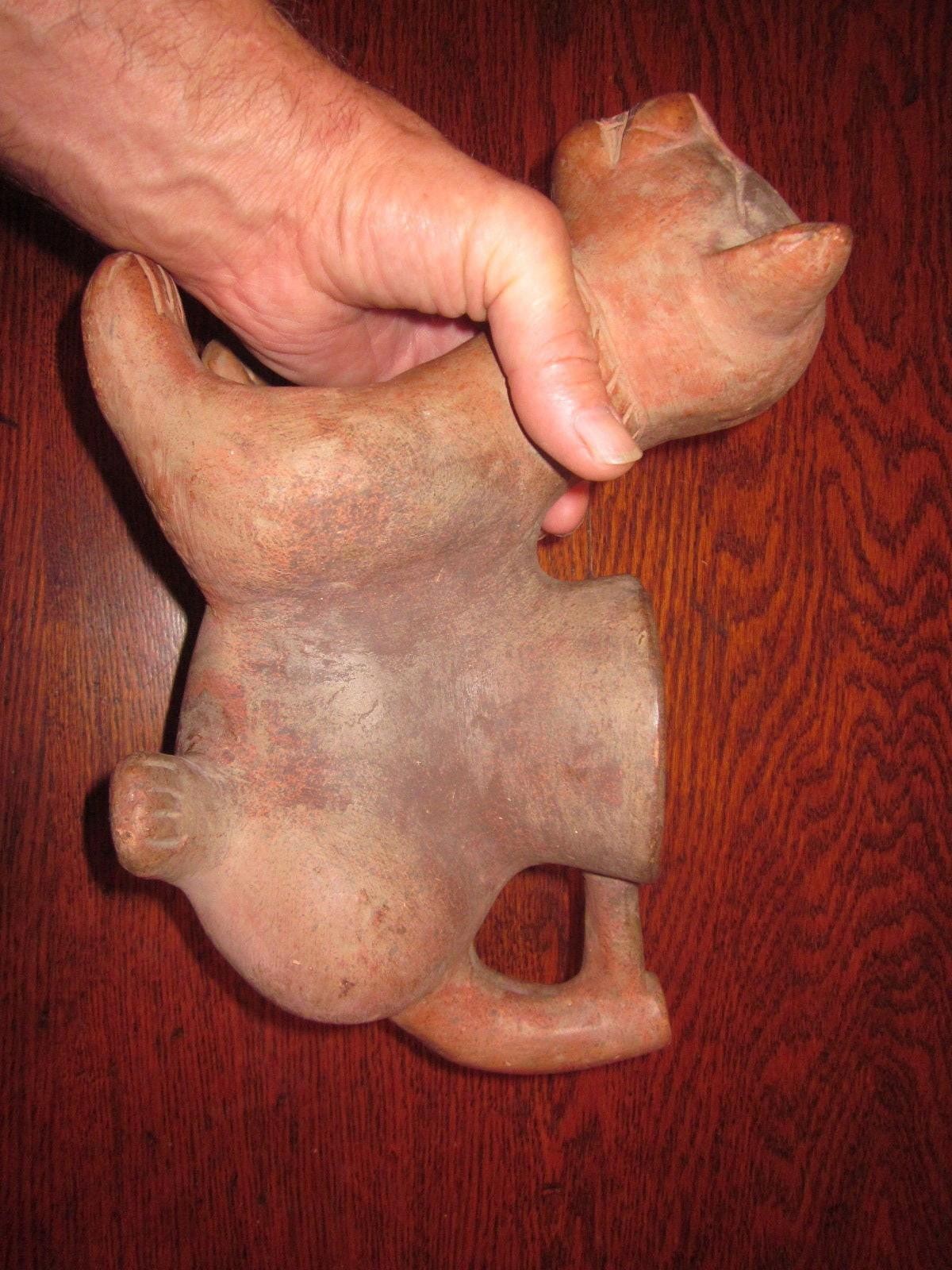 It looks like a Pre-Columbian Colima Dog Lamp/Vessel, un-glazed