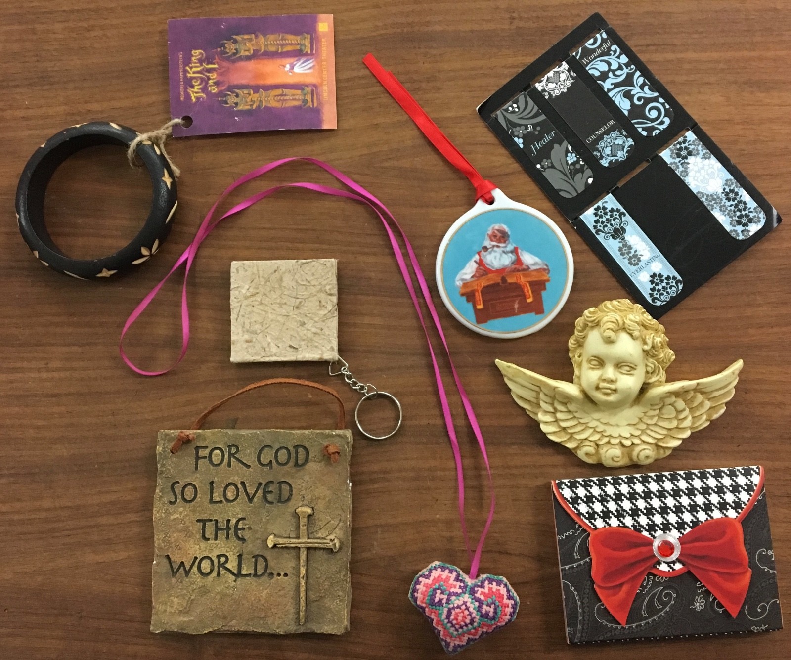 Eight pieces random but useful items. Religious, jewelry, note pad, wall art
