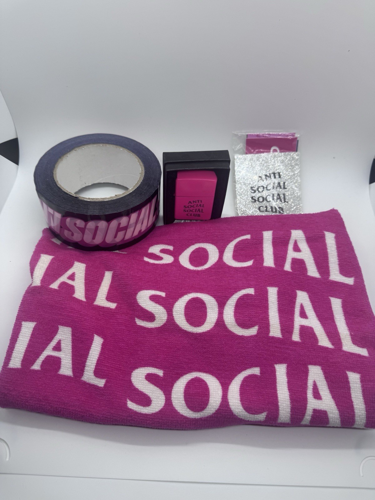 Lot Of Anti Social Social Club Items Towel, Tape, Stickers And No Regrets Zippo