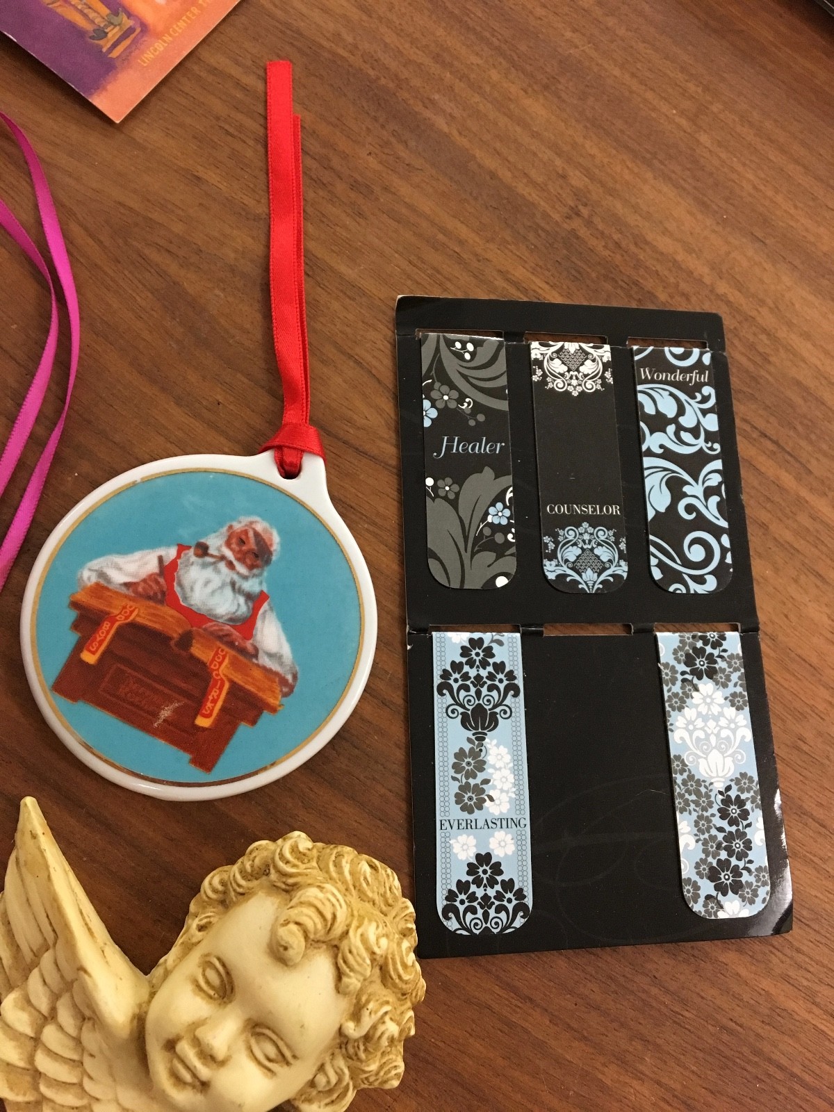 Eight pieces random but useful items. Religious, jewelry, note pad, wall art