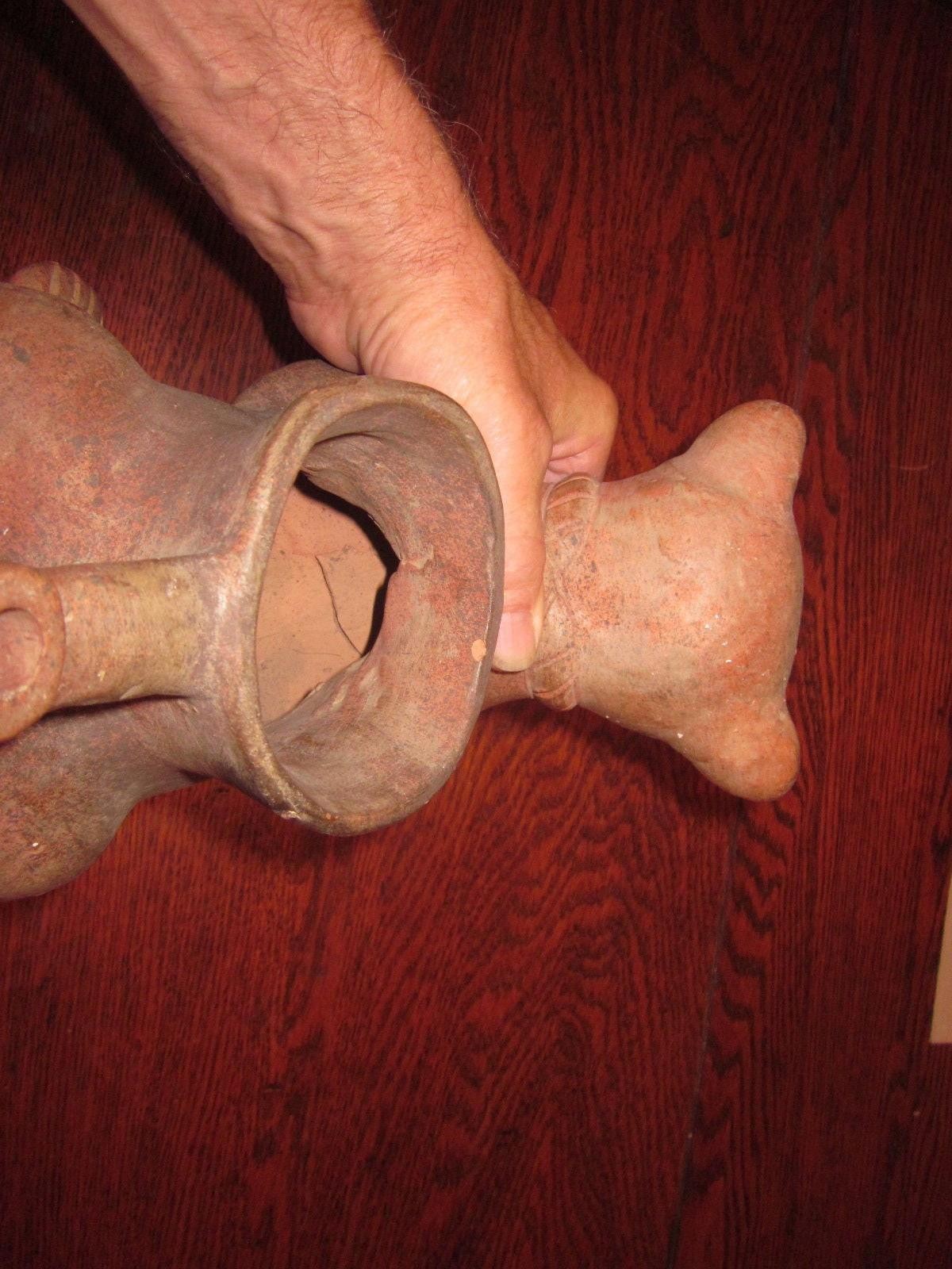 It looks like a Pre-Columbian Colima Dog Lamp/Vessel, un-glazed