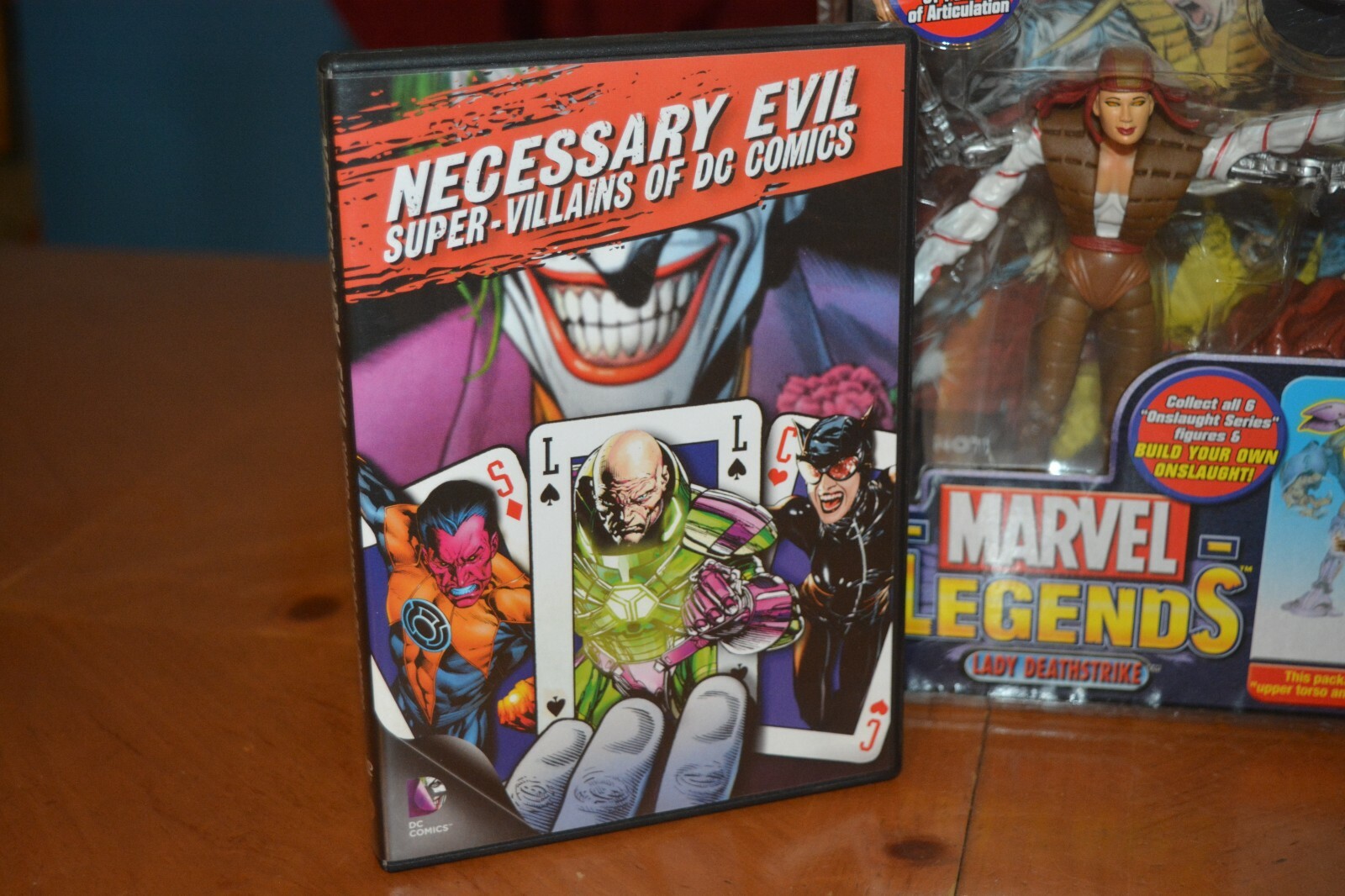 DVD COMIC BOOK COLLECTION WITH RARE MARVEL LEGENDS LADY DEATHSTROKE FIGURE