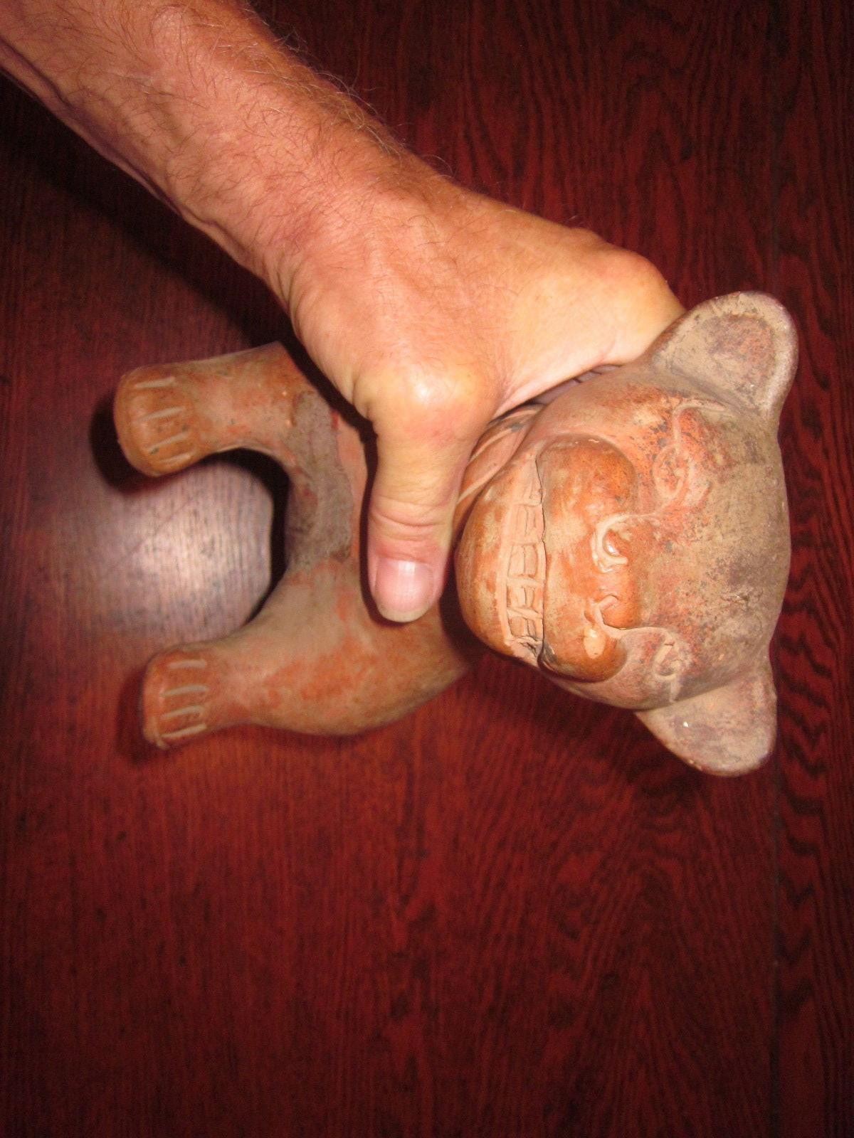 It looks like a Pre-Columbian Colima Dog Lamp/Vessel, un-glazed