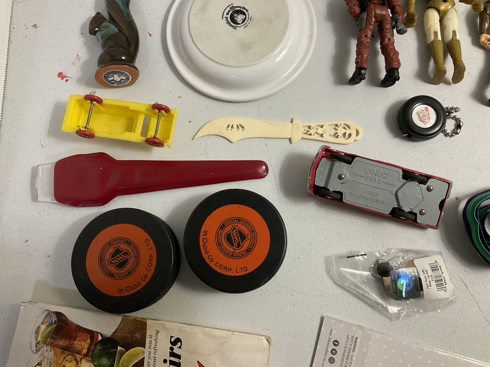 Vintage large junk drawer Lot NHL hockey pucks action figures Corgi Car Misc.