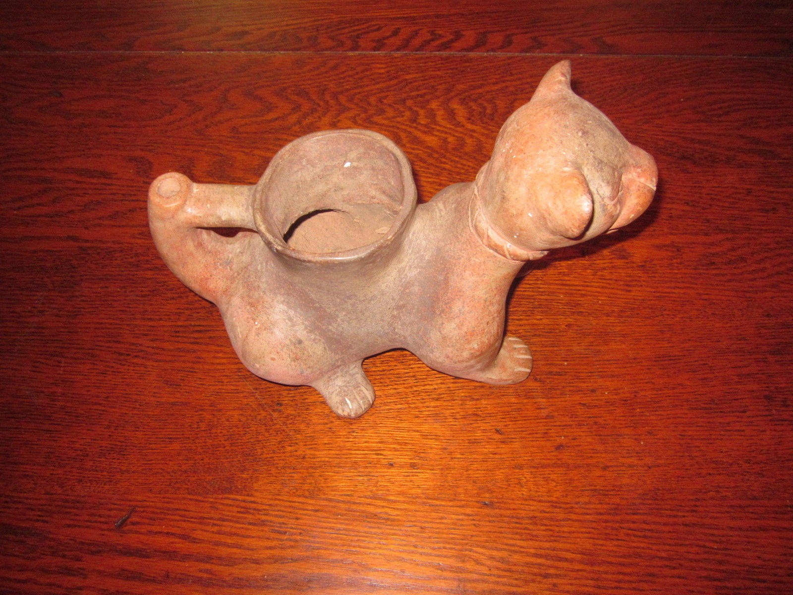 It looks like a Pre-Columbian Colima Dog Lamp/Vessel, un-glazed