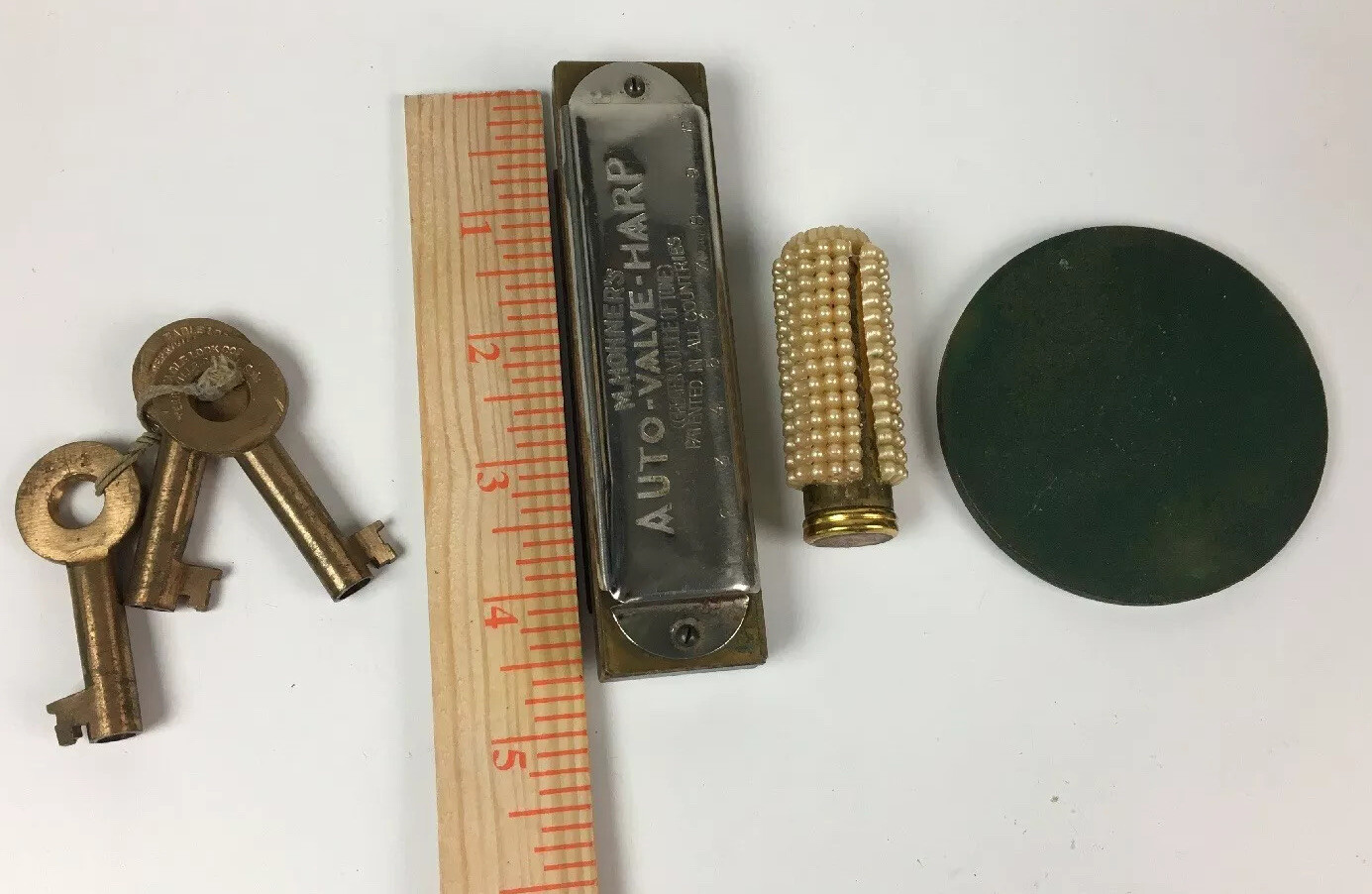 Mixed vintage lot – Hohner harmonica, Revlon, Eagle lock keys, Presbytarian coin