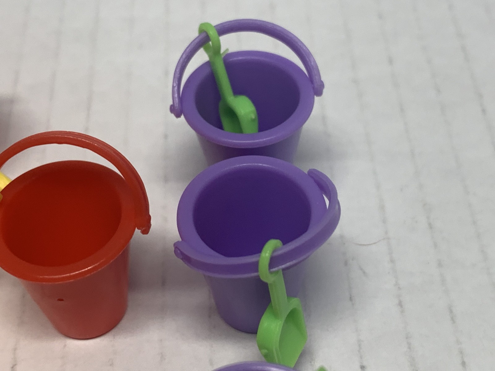 WORLDS SMALLEST MICRO TOY BOX SERIES 1,BUCKET W/SHOVEL X7. 4 RED & 3 PURPLE NICE
