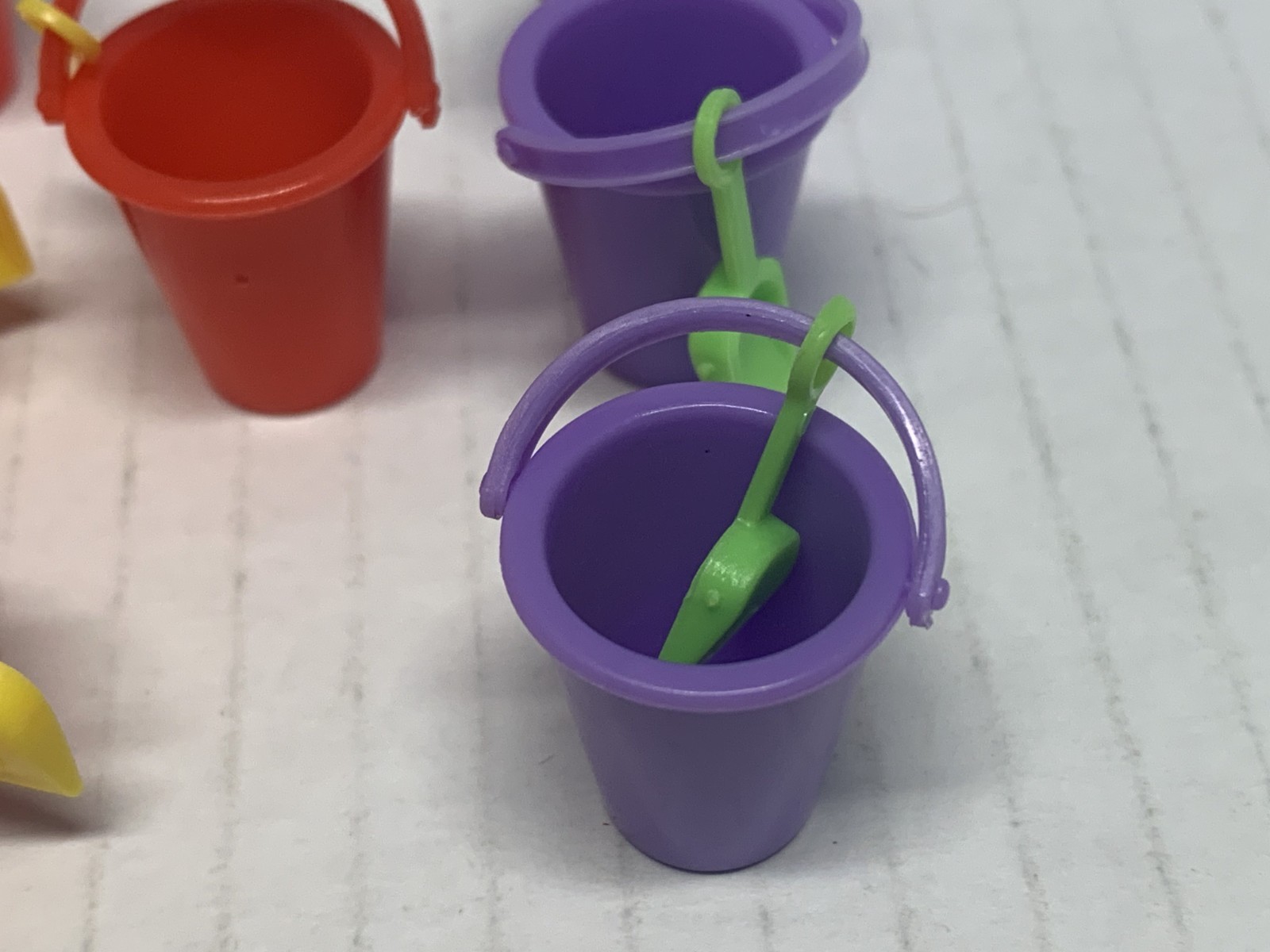 WORLDS SMALLEST MICRO TOY BOX SERIES 1,BUCKET W/SHOVEL X7. 4 RED & 3 PURPLE NICE