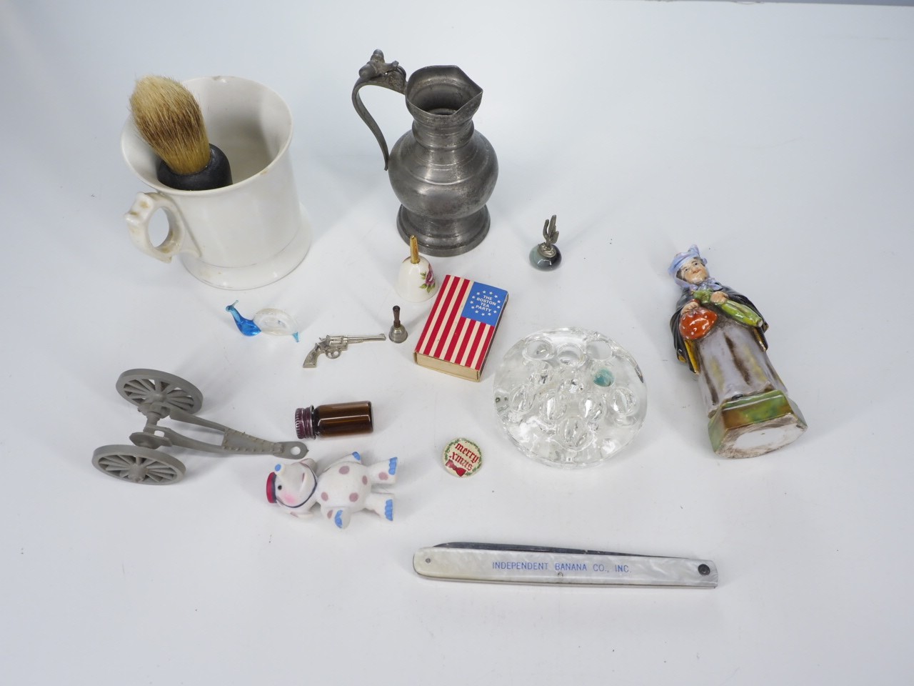 Junk drawer lot knife, figurine, pewter, matches.